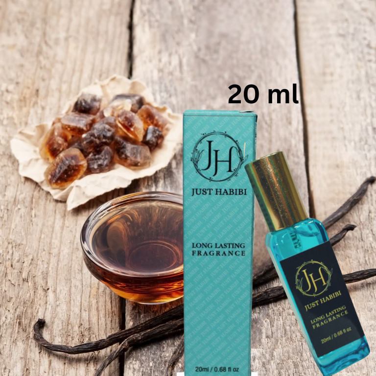 Just Habibi™  20 ml perfume bottle and packaging.  on a wooden surface with vanilla beans and honeycomb.