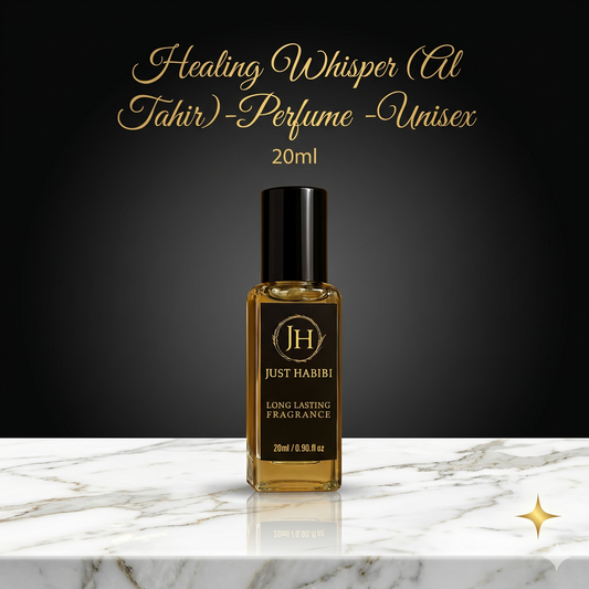 Perfume bottle labeled 'Just Habibi' on a marble surface with a dark background