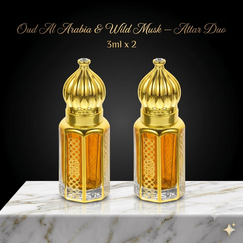 Two gold and amber perfume bottles on a marble surface with a black background.