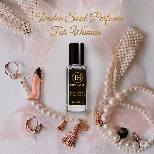 Perfume bottle labeled 'Just Habibi' surrounded by pearls and jewelry on a soft pink background.