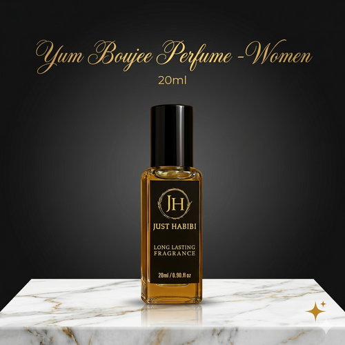 Perfume bottle labeled 'Just Habibi' on a marble surface with a dark background